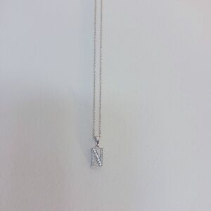 Silver N necklace with gems